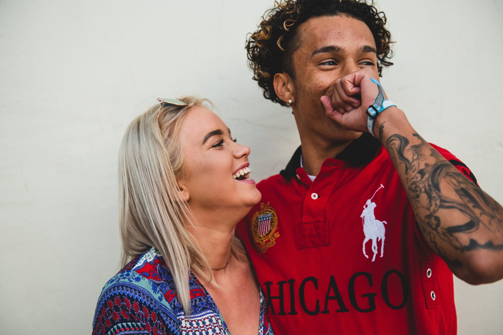 biracial couple hugging and laughing together